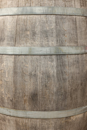 Traditional wooden barrel as background, closeup. Wine making