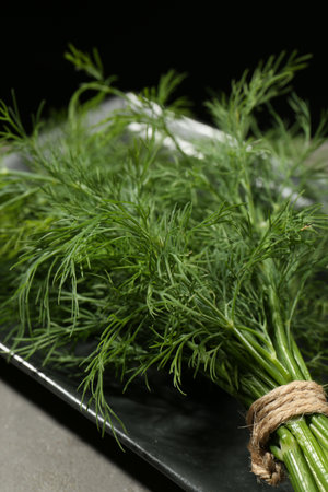 Bunch of fresh dill on gray table, closeupの写真素材