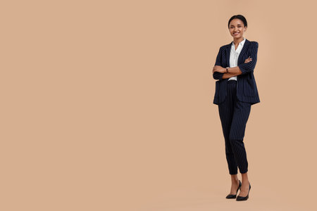 Beautiful secretary on beige background, space for textの写真素材