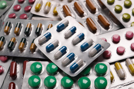 Many blisters with different pills as background, closeupの写真素材