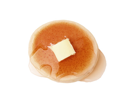 Delicious pancake with honey and butter isolated on white, top viewの写真素材