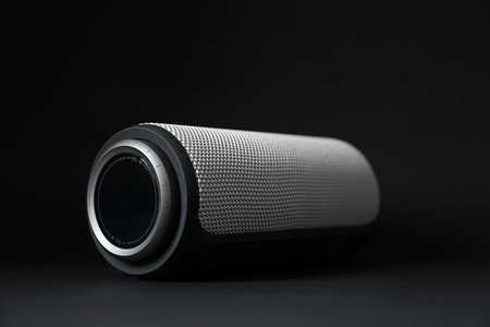 One portable bluetooth speaker on black background, closeup. Audio equipmentの写真素材