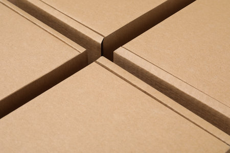 Closed cardboard boxes as background, closeup. Packaging goods