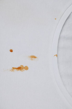 Stains of sauce on white t-shirt, top viewの写真素材