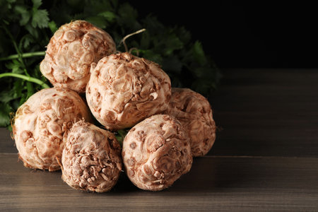 Fresh raw celery roots on wooden table, closeupの写真素材