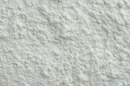 Rice loose face powder as background, top view