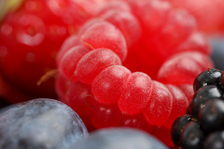 Different fresh ripe berries as background, macro view