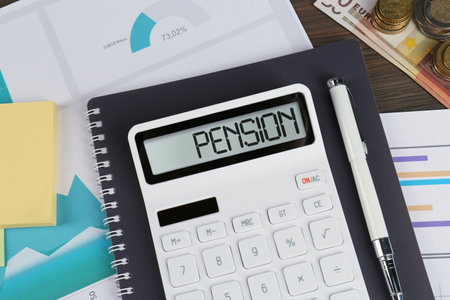 Calculator, money, papers, pen and notebook on table, flat lay. Pension planningの写真素材