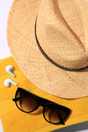 Beach accessories on white background, closeup view