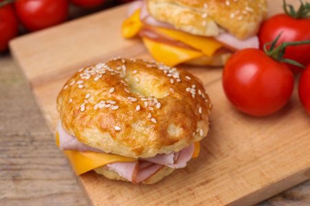 Delicious bagels with ham and cheese on table, closeupの写真素材