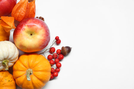 Thanksgiving day. Flat lay composition with pumpkins on white background, space for textの写真素材