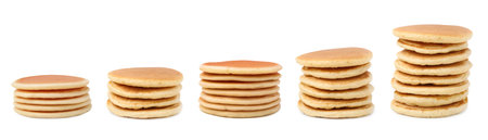 Set of tasty pancakes isolated on whiteの写真素材