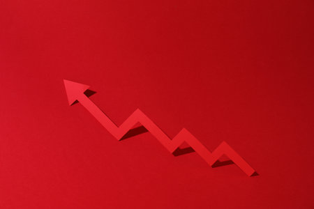 One zigzag paper arrow on red backgroundの写真素材