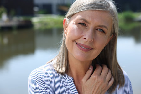 Portrait of beautiful happy senior woman outdoors