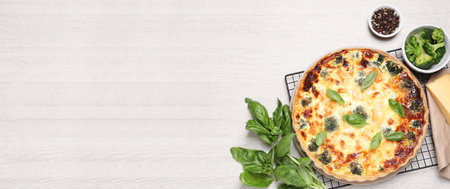 Delicious homemade salmon quiche and ingredients on white wooden table, flat lay. Banner design with...