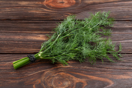 Bunch of fresh dill on wooden table, top viewの写真素材