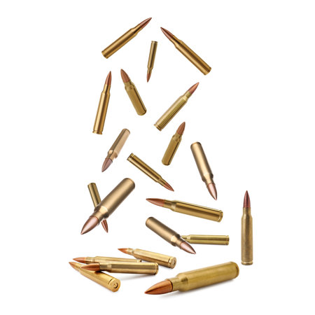Many bullets falling on white background. Firearm ammunitionの写真素材