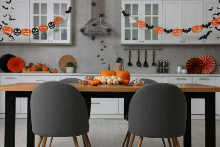Stylish kitchen interior with festive decor. Halloween celebrationの写真素材