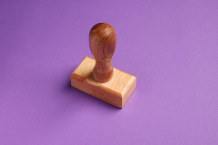 One wooden stamp tool on purple backgroundの写真素材