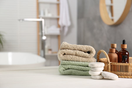Composition with spa products on white table in bathroom, space for textの写真素材