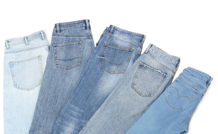 Different stylish jeans isolated on white, top viewの写真素材
