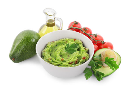 Delicious guacamole and ingredients isolated on whiteの写真素材