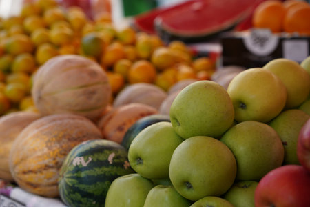 Different fresh ripe fruits on counter at market, closeupの写真素材