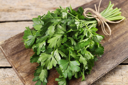 Bunch of fresh green parsley leaves on wooden table, closeupの写真素材