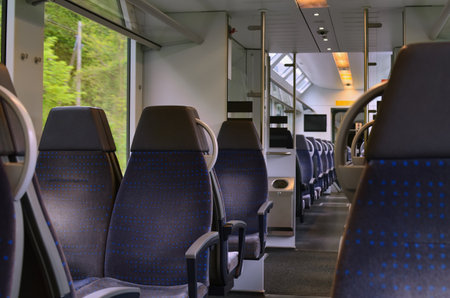 Comfortable seats in empty modern passenger trainの写真素材