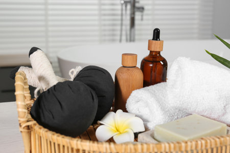 Beautiful composition with different spa products and flower on table in bathroom, closeupの写真素材