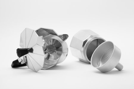 Disassembled moka pot on white background. Coffee maker