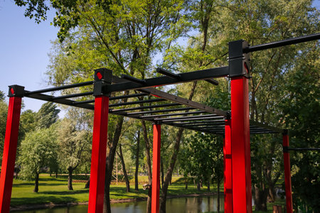 Empty outdoor gym with exercise equipment in park