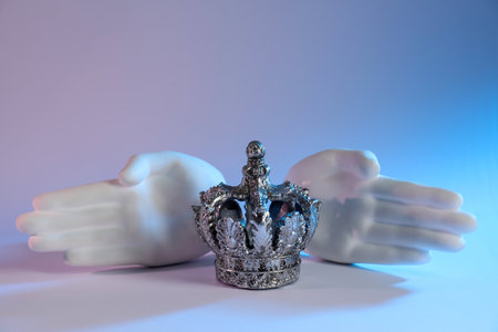 Beautiful silver crown and other decor elements on white background, space for text. Color tone...