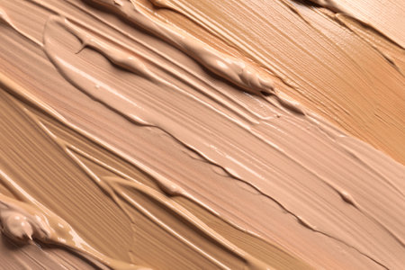 Samples of skin foundation as background, closeup