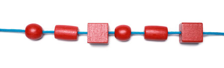 Wooden pieces and string for threading activity isolated on white, top view. Educational toy for...