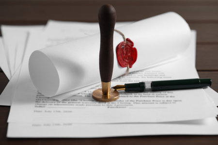 Notary contract. Documents, wax stamp and pen on table