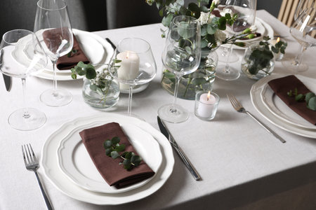 Beautiful table setting with silverware and floral decor
