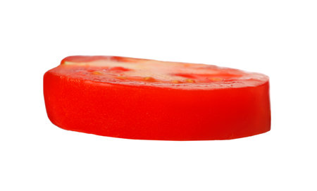 Slice of fresh ripe tomato isolated on whiteの写真素材
