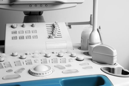 Ultrasound control panel with ultrasonic transducers and transmission gel in hospital, closeup. Medical equipmentの写真素材