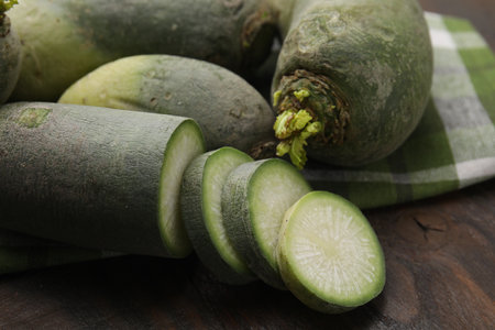 Green daikon radishes on wooden table, closeupの写真素材