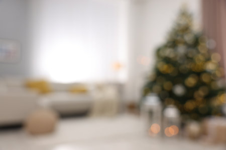 Christmas tree in furnished living room, blurred view. Festive interior designの写真素材
