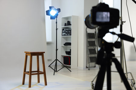 Camera, stool and different equipment for casting in studio, selective focusの写真素材