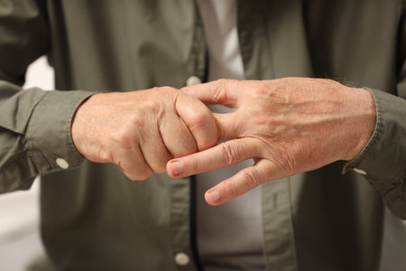 Senior man suffering from pain in hand, closeup. Rheumatism symptomの写真素材