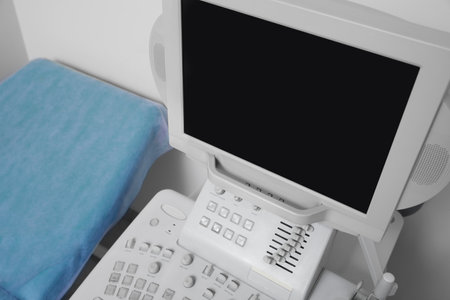 Ultrasound machine and examination table in hospital, above view