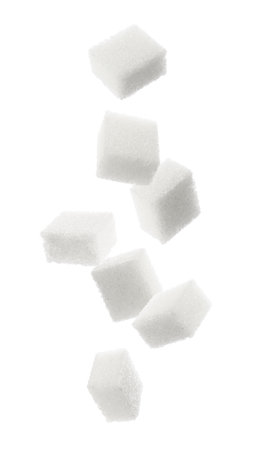 Cubes of sugar falling on white backgroundの写真素材