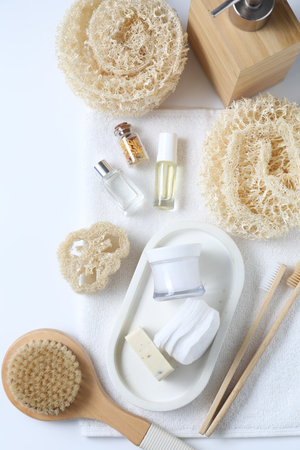 Bath accessories. Flat lay composition with personal care products on white backgroundの写真素材