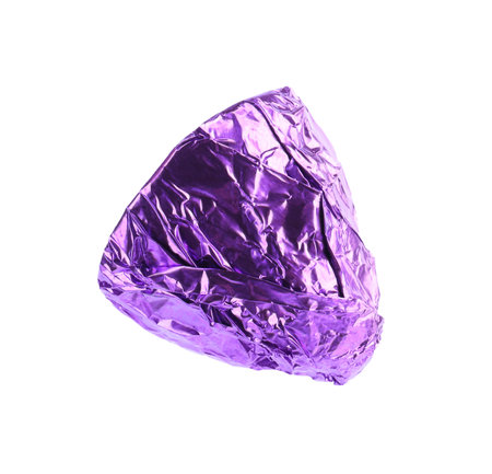 Tasty candy in purple wrapper isolated on whiteの写真素材