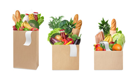 Paper bags with different products and receipts isolated on white, collectionの写真素材