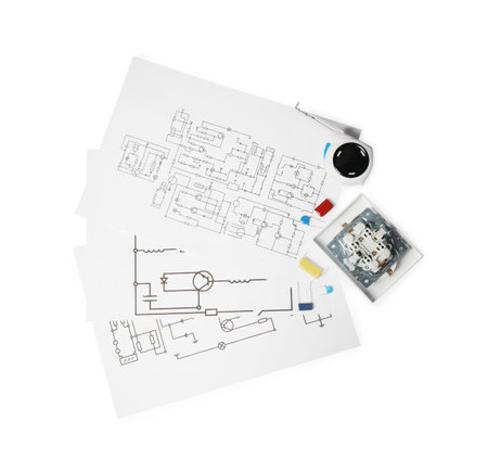 Wiring diagrams, tape measure and disassembled light switch isolated on white, top viewの写真素材