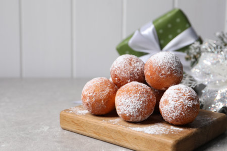 Delicious sweet buns on gray table, space for text